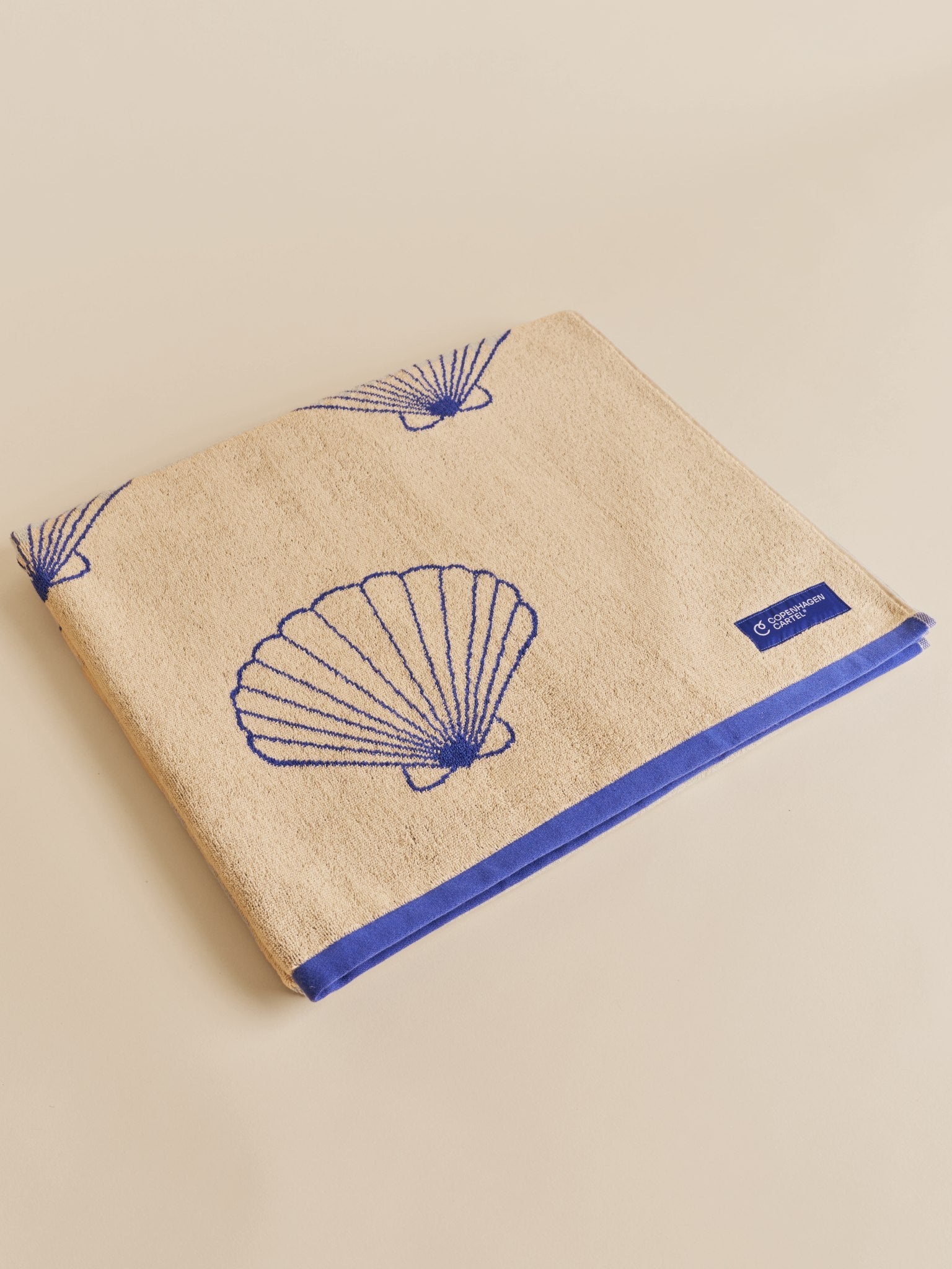 Shell strandhåndklæde - Sand/Cartel Blue